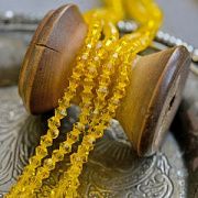 Бусина, стекло биконус, цвет насыщенный желтый, 4 мм (уп.30+/-5 шт)